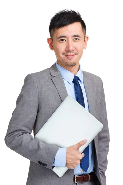 Business man holding laptop computer — Stock Photo, Image