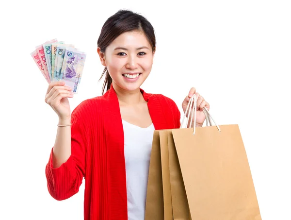 Chica con bolsa de compras y dinero en efectivo —  Fotos de Stock