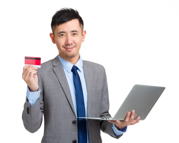 Business man hold credit card and laptop — Stock Photo, Image