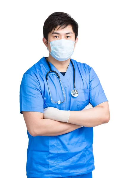 Doktor s obličejovou maskou v chirurgické uniformě — Stock fotografie