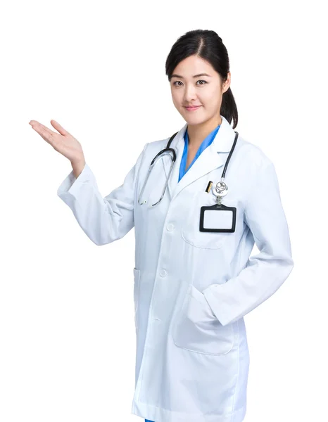 Doctor woman with hand show something — Stock Photo, Image