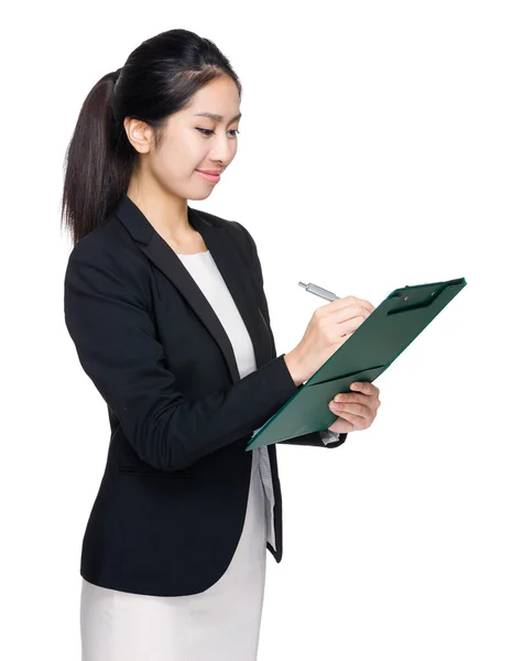 Businesswoman write on clipboard — Stock Photo, Image