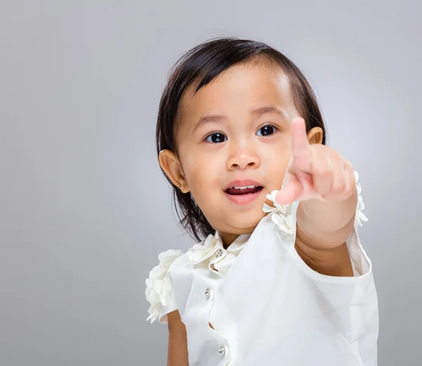 Bambino ragazza dito punto a fronte — Foto Stock