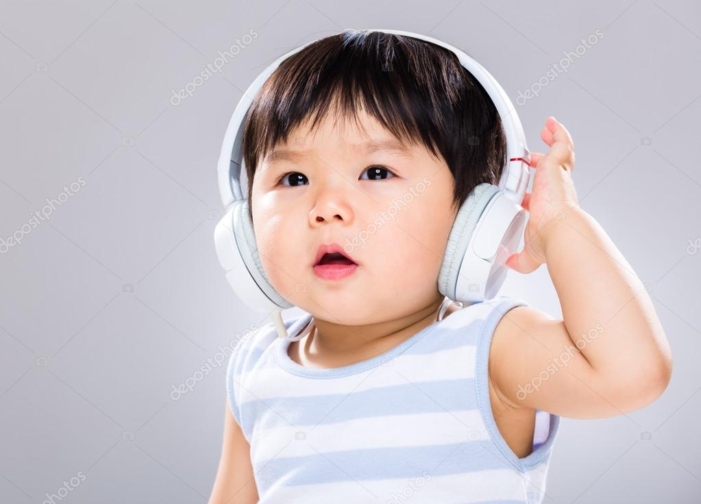 Baby boy wear headphone