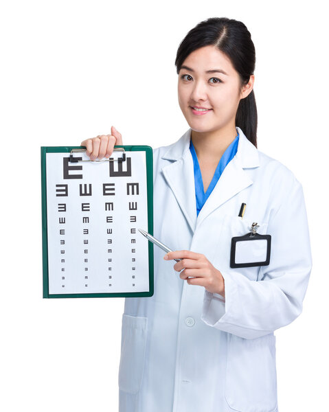 Doctor with pen point to eye chart