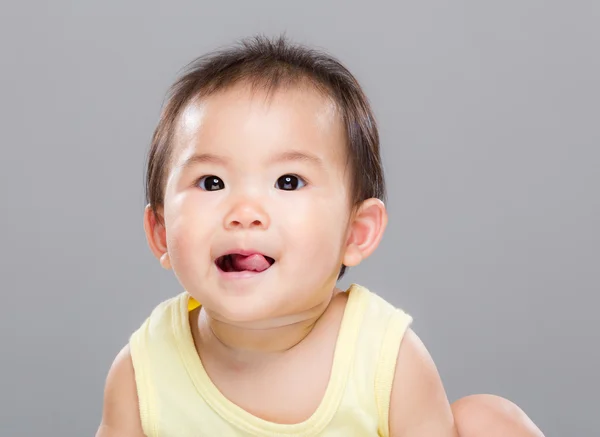 Baby girl show tongue — Stock Photo, Image