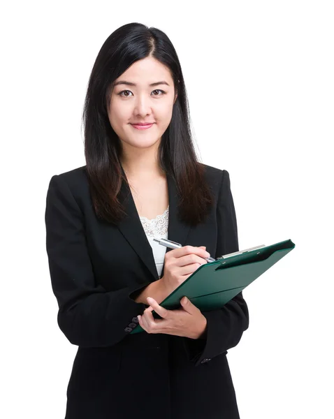 Business woman jot something on file pad — Stock Photo, Image