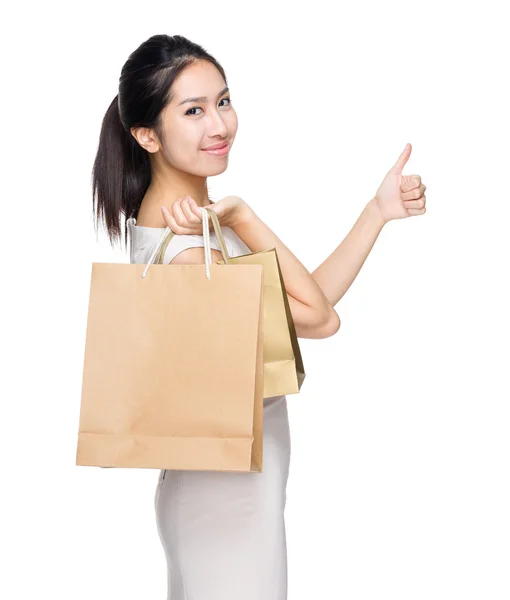 Menina feliz com saco de compras e polegar para cima — Fotografia de Stock