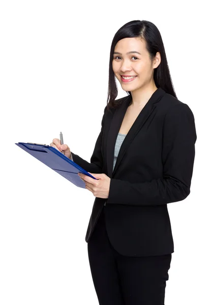 Secretary wirte on clipboard — Stock Photo, Image