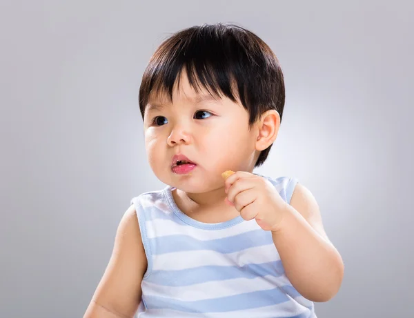Asian baby boy eat finger food — Stock Photo, Image