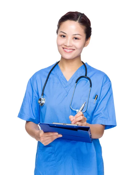 Female doctor write on clipboard — Stock Photo, Image