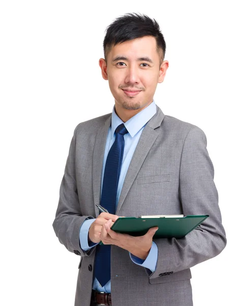 Businessman write on clipboard — Stock Photo, Image