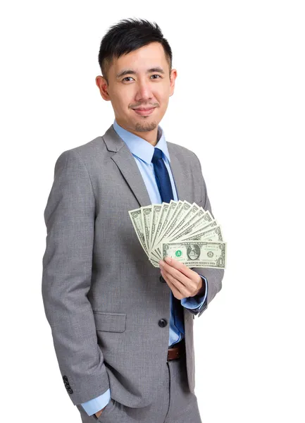 Азиатский бизнесмен держит с наличными — стоковое фото