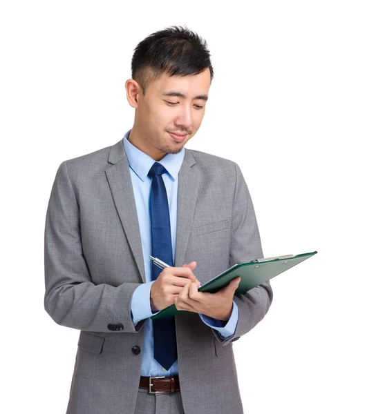 Businessman write on clipboard — Stock Photo, Image