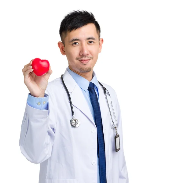 Male doctor with heart shape ball — Stock Photo, Image