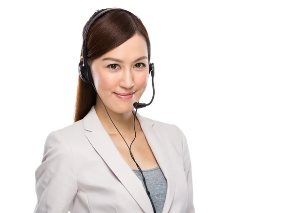 Aziatische zakenvrouw met hoofdtelefoon — Stockfoto