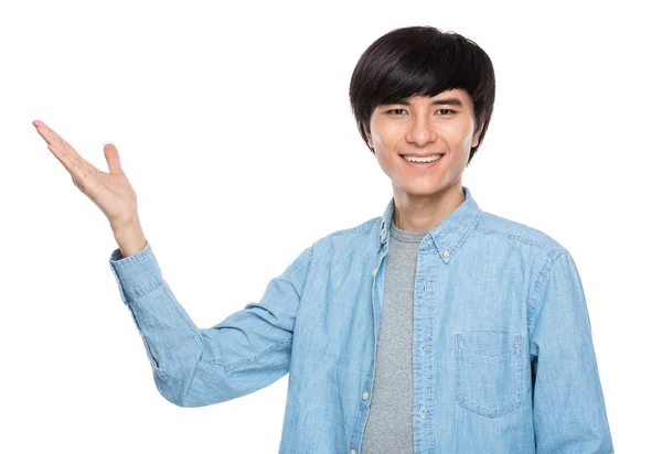 Young man with hand presentation — Stock Photo, Image