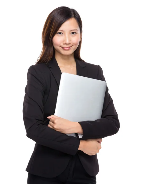 Businesswoman holding computer — Stock Photo, Image