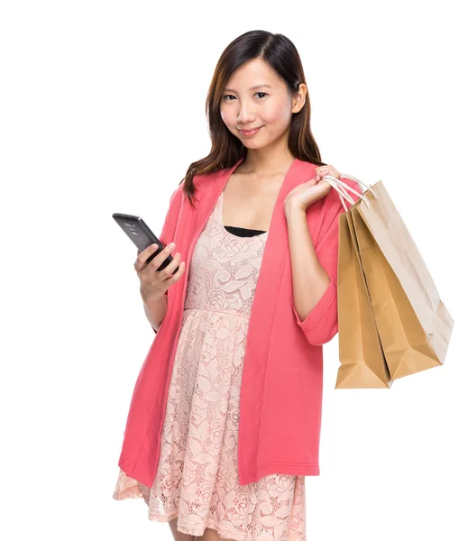 Mujer con bolsos y teléfono — Foto de Stock