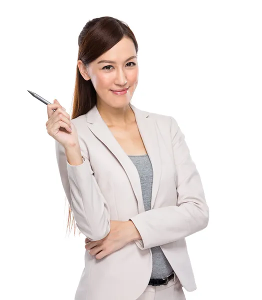 Businesswoman pointing with pen — Stock Photo, Image