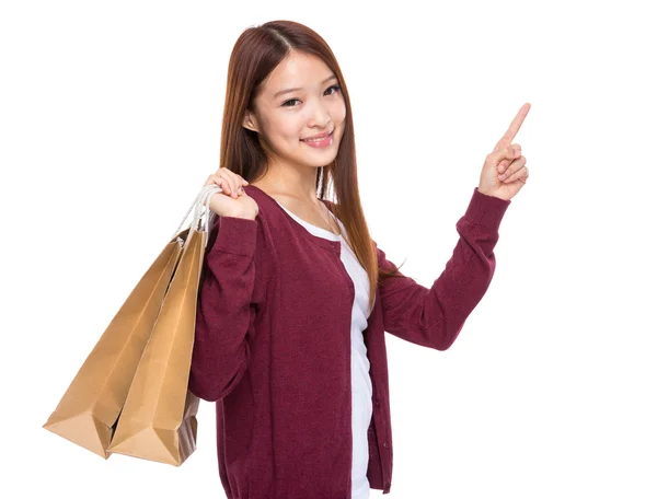 Femme avec sac à provisions et doigt vers le haut — Photo