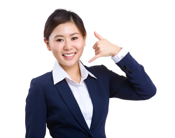 Businesswoman with call me sign — Stock Photo, Image