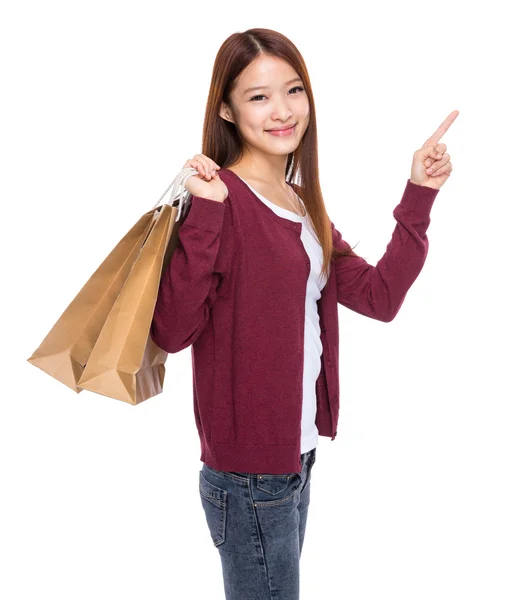 Frau mit Einkaufstasche und erhobenem Finger — Stockfoto