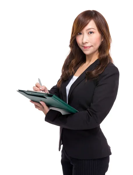 Businesswoman write on clipboard — Stock Photo, Image