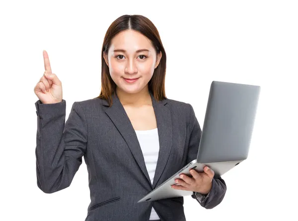 Businesswoman with laptop and finger up — Stock Photo, Image