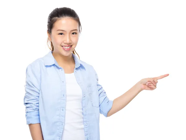 Young woman with finger point aside — Stock Photo, Image