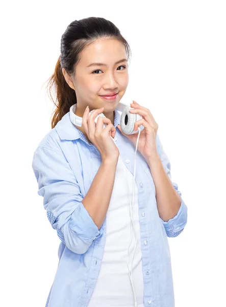 Asian young woman with headphone on shoulder — Stock Photo, Image