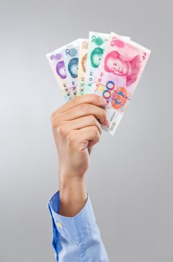 farklı Çince banknot işadamı elini tut