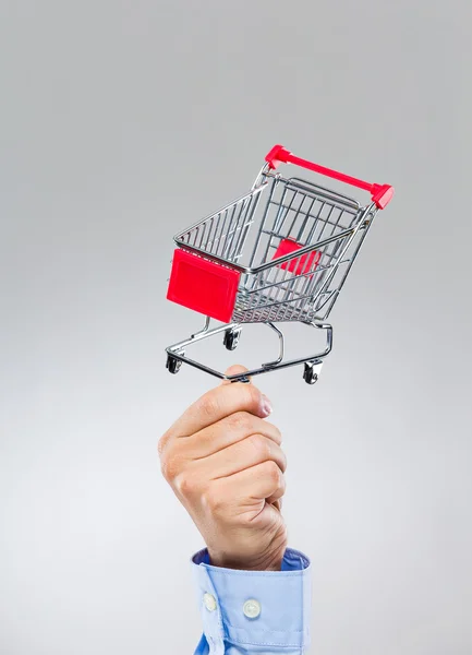 Businessman hold with small shopping cart — Stock Photo, Image