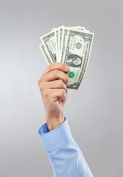 Businessman hand hold group of US dollar — Stock Photo, Image