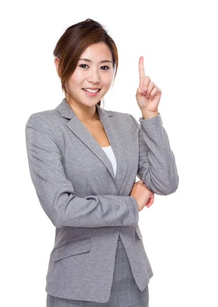 Geschäftsfrau mit erhobenem Zeigefinger — Stockfoto