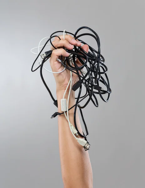 Male hand hold group of cable cords — Stock Photo, Image