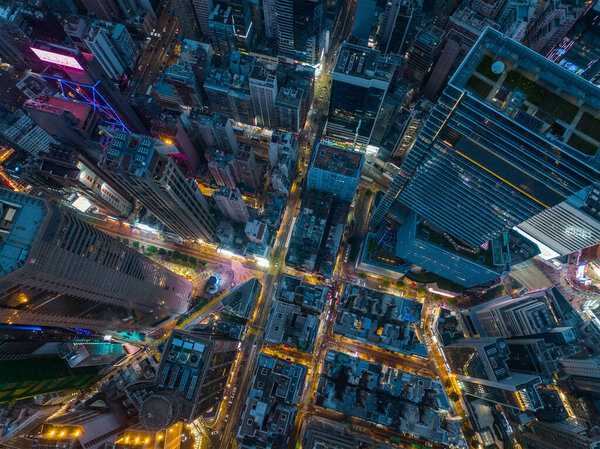 Causeway Bay, Hong Kong - 29 January 2022: Drone fly over Hong Kong city at night