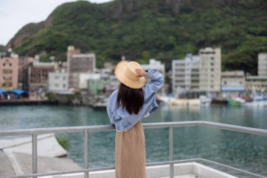 Woman visit yehliu fishing harbor