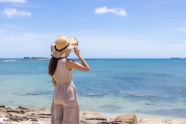 Woman visit the sea beach in Penghu of Taiwan