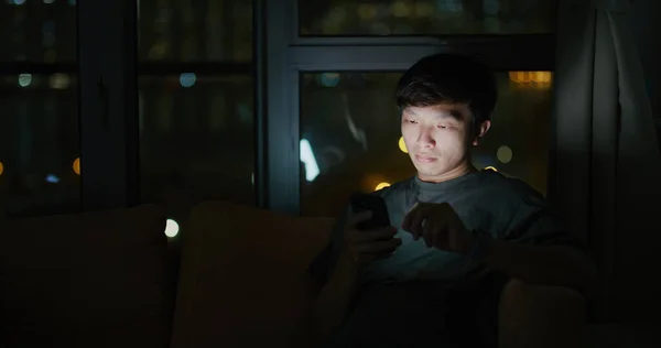Asian Man Use Mobile Phone Home — Stok fotoğraf