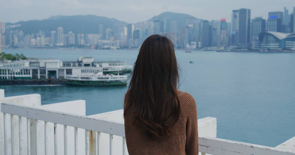 Woman look at the city of Hong Kong city