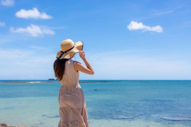 Woman enjoy the sea view in summer time