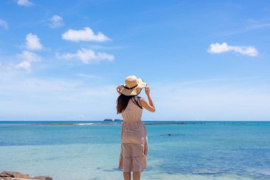 Woman enjoy the sea view in summer time