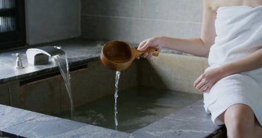 Woman enjoy her hot spring at winter time