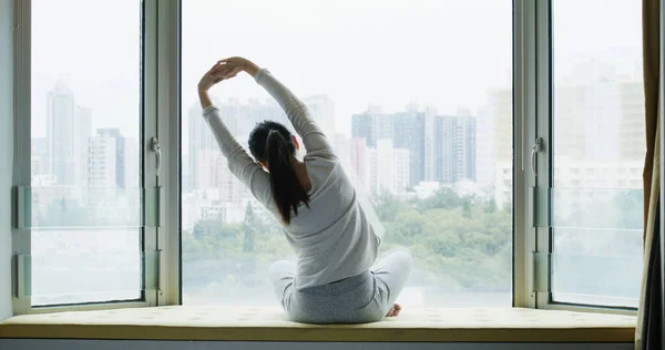 Woman Stretching Exercises Sit Front Window — Stockfoto