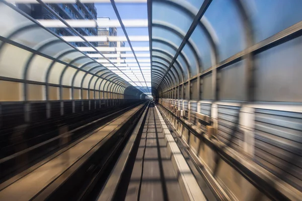 Motion blur of train moving inside tunnel