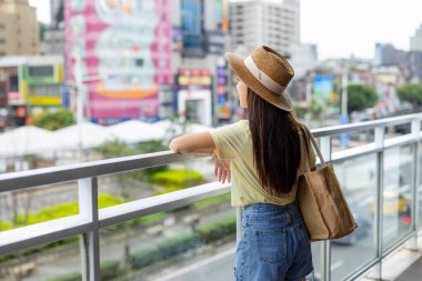 Woman look at the city in Kee Lung
