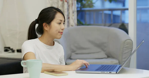 Woman work on notebook computer at home