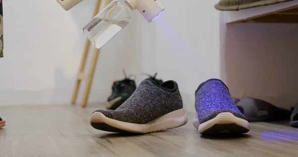 UV Light alcohol spray for cleaning pair of shoes