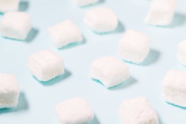 White Marshmallow over blue background
